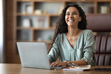 Poster - Emotional young lady typing on notebook keyboard