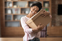 Delighted Woman Customer Hugging Paper Box Parcel