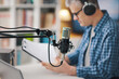 © StockPhotoPro - Professional speaker checking the podcast schedule