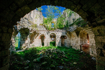 Old abandoned overgrown ruins of church