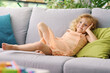 © StockPhotoPro - Cute girl relaxing on the couch at home