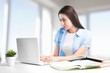 © BillionPhotos.com - Woman student using computer laptop.
