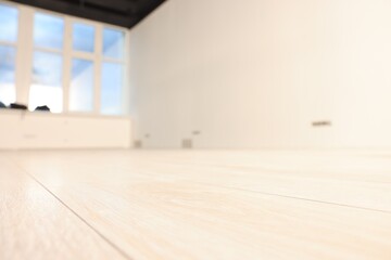 Sticker - Empty room with new white laminated flooring, closeup