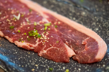 Wall Mural - Premium rare sliced beef served for Yakiniku. Close up