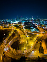 Wall Mural - Aerial vertical view of Brisbane city and highway traffic in Australia at night