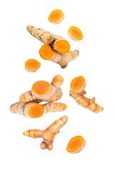 Wall Mural - Turmeric spice with cut slices  flying in the air isolated on white background.