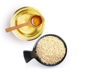 Wall Mural - Sesame oil with seeds isolated on white background. Top view. Flat lay.