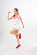 © StockPhotoRepublic - Studio portrait photo of a young beautiful elegant Brazilian female model lady wearing sports exercise running attire posing with a series moments of emotion and gesture