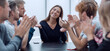 © ASDF - group of ambitious young business people sitting at an office Desk