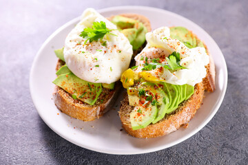 Wall Mural - bread toast with avocado and poached egg