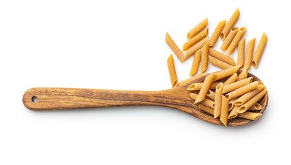 Wall Mural - Uncooked whole grain pasta isolated on white background. Raw penne pasta on spoon.