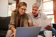 © Nina Lawrenson/peopleimages.com - Retirement couple budget, finance and investment planning, loan and paper bills with laptop technology in home. Mature people money, cash savings or legal insurance document report on online bank