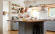 © N Lawrenson/peopleimages.com - Senior couple in the kitchen cooking together for a party, dinner or lunch in their modern home. Fun, dessert and elderly man and woman in retirement baking, bonding and talking in their house.