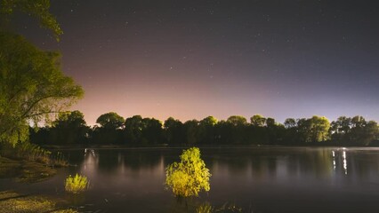 Wall Mural - From Dusk To Dawn. Night Sky Above River. 4k Timelapse. Night Sky Turns Into Morning. The Stars Float Across Sky. Dawn Is Coming. Time Lapse. Time-lapse. Timelapse.