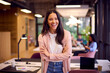 © Monkey Business - Portrait Of Smiling Businesswoman Standing In Modern Open Plan Office