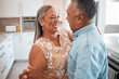 © Beaunitta Van Wyk/peopleimages.com - Senior couple dance in kitchen with celebration for retirement, real estate or happy marriage. Elderly pension people dancing to music with love, care and wellness in their house or home together