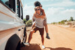 © Kay Abrahams/peopleimages.com - Couple piggy back on road trip travel in Australia, adventure in summer holiday and outdoor truck drive. Young happy people walking on path, fun vacation lifestyle together and transport