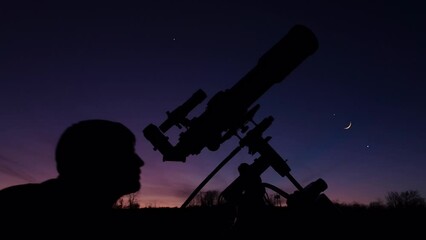 Wall Mural - silhouette of a man, telescope, stars, planets and shooting star under the night sky.