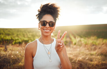 Wall Mural - Peace sign, travel and black woman on safari holiday during summer in Kenya. Portrait of a happy, relax and African girl with hand for photo, adventure and happiness on vacation in the countryside