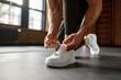© Nomad_Soul - Closeup of sportsman tying sneakers preparing for training