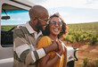 © Siphosethu Fanti/peopleimages.com - Travel, love and black couple on a road trip in nature on a happy summer holiday or vacation outdoors. Smile, happiness and fun woman hugging, bonding and relaxing with partner on a romantic journey