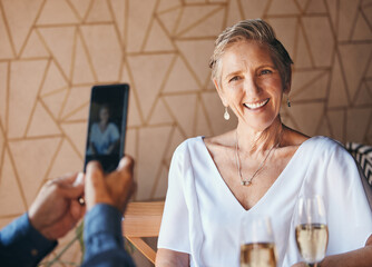 Sticker - Smile, phone and photograph, senior woman on lunch date in cafe with with champagne. Smartphone, picture on screen and a happy elderly couple in love on romantic anniversary celebration in restaurant