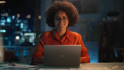 Poster - Beautiful Multiethnic Brazilian Female Working on Laptop Computer Late at Night. Young Creative Manager Feeling Happy, Looking at Camera and Smiling. Zoom In Portrait Footage.