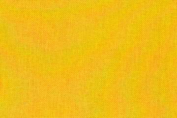 Wall Mural - Yellow golden fabric cloth texture background, seamless pattern of natural textile
