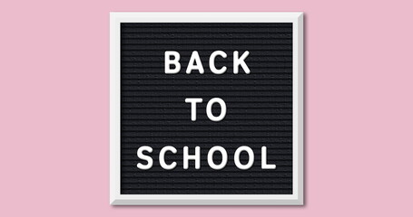 Canvas Print - Image of back to school on board over pink background