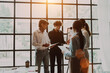 © NanSan - Asian business adviser meeting in boardroom with accounting paper charts accountancy document at desk workspace.