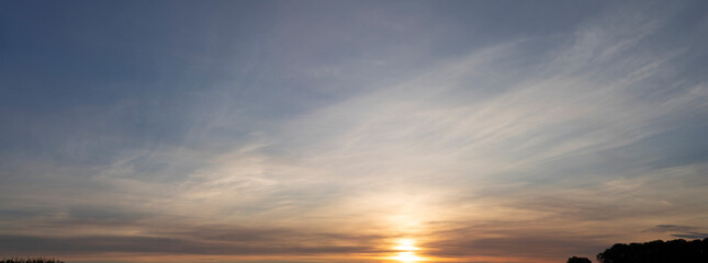 Wall Mural - Panorama of abstract dawn golden sky landscape, sunrise in the morning in autumn season. Horizon scene panoramic view, landscape image