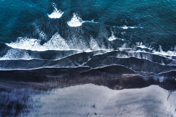 Wall Mural - Moody atlantic ocean wave on black sand beach in summer at Iceland
