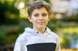 © Irina Schmidt - Portrait of preteen school kid boy. Beautiful happy child looking at the camera. Schoolboy smiling. Education concept.