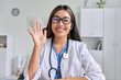 © Stock 4 You - Asian doctor talking to web cam consulting via virtual telemedicine advice
