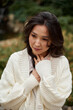 © olga pink - Close up beautiful asian kazakh brunette woman black long hair n cozy autumn season.