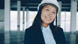 © silverkblack - Portrait of Asian woman engineer standing indoors new building wearing safety helmet smiling enjoying work. People and professions concept.