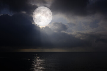 landscape moon over the horizon on sea and moonlight. panorama with the luna of night. grand mystica