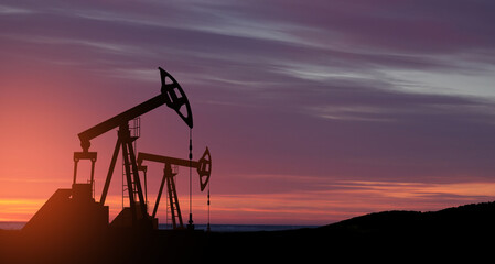 Wall Mural - The change in oil prices caused by the war. Oil prices are rising because of the global crisis. Oil drilling derricks at desert oilfield. Crude oil production from the ground. Petroleum production.