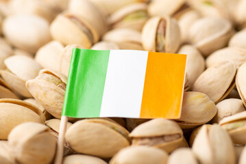 Wall Mural - Flag of Ireland on pistachio nuts. Growing pistachios in Ireland concept