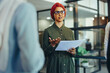 © Jacob Lund - Muslim business woman leading a team meeting in a modern office