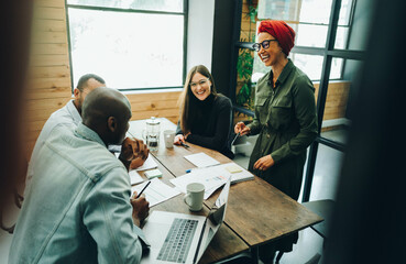 Wall Mural - Group of diverse businesspeople having a meeting in an office boardroom