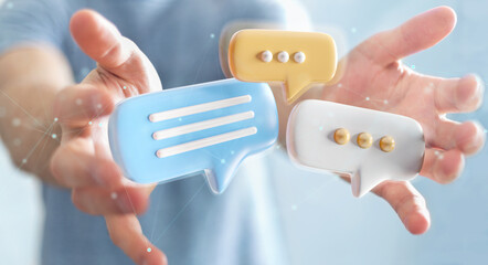 Wall Mural - Businessman holding digital speech bubbles talk icons. Minimal conversation or social media messages floating between man hands. 3D rendering