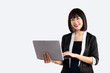 © CREATIVE WONDER - Business woman using laptop computer posing smiling on white background.
