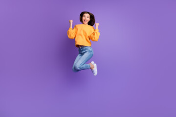 Canvas Print - Full size photo of charming crazy jumper woman active sportive fists up celebrate hooray triumphant finally result isolated on purple color background