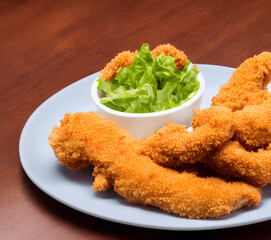 Wall Mural - picture of chicken tenders, made of processed meat, a tasty fast food, savory