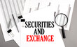 SECURITIES AND EXCHANGE text on paper on chart background