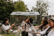 © Johnér - Friends having meal in garden