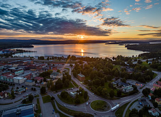 Canvas Print - Sunset at a lake and a town in Sweden