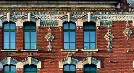 Wall Mural - red brick and art deco tiled decoration on the facade of Lamartine middle school in Dunkirk, france