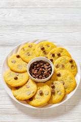 Wall Mural - chocolate chip lemon yellow cookies on a plate